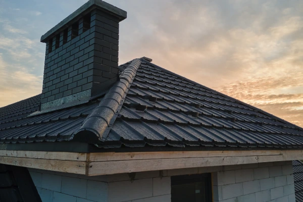 slate roofed house with a chimney